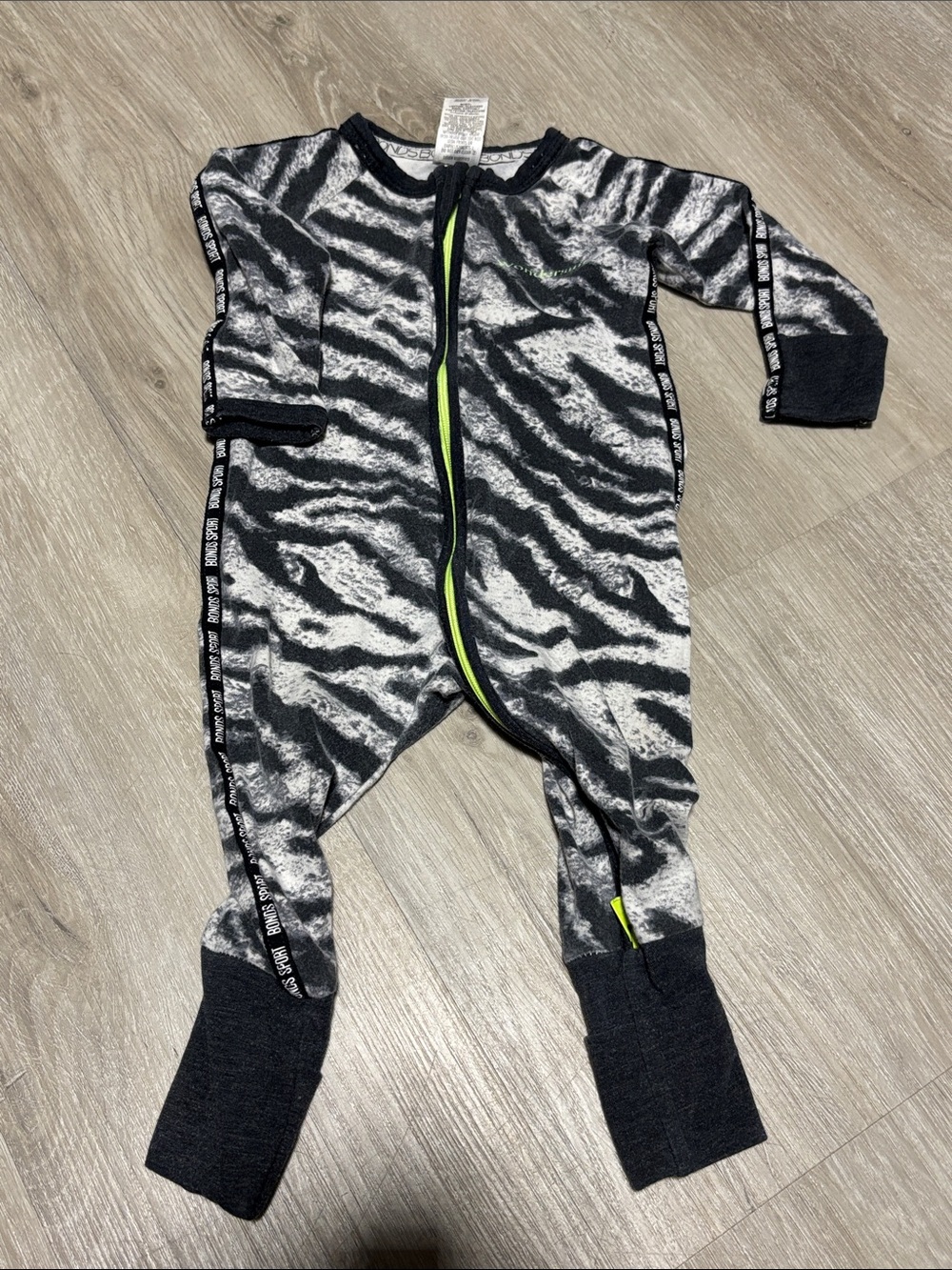 Bonds Zebra-Print Footed One-Piece in Black, Gray and Neon Green